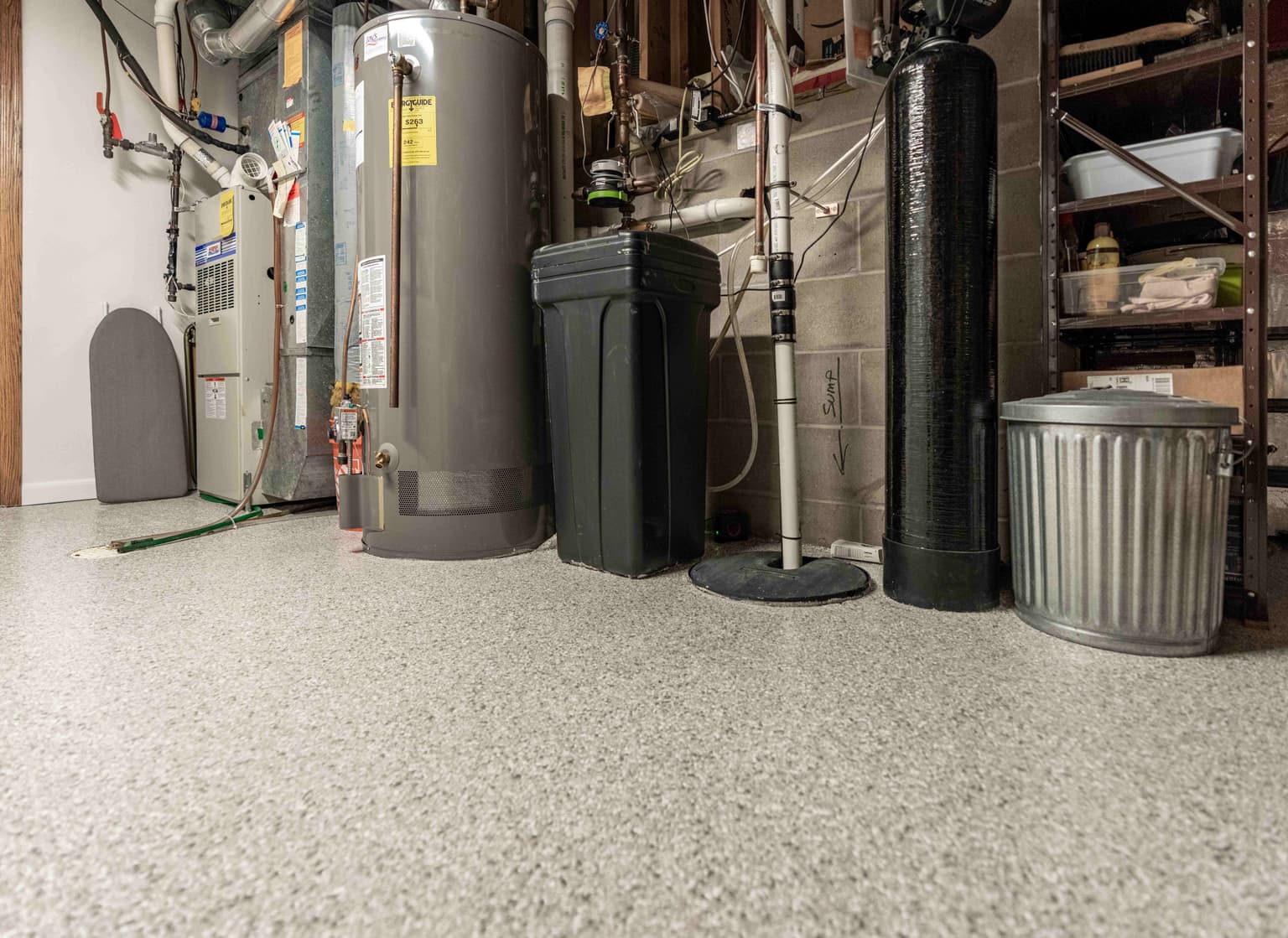 Basement utility room with protective concrete coating
