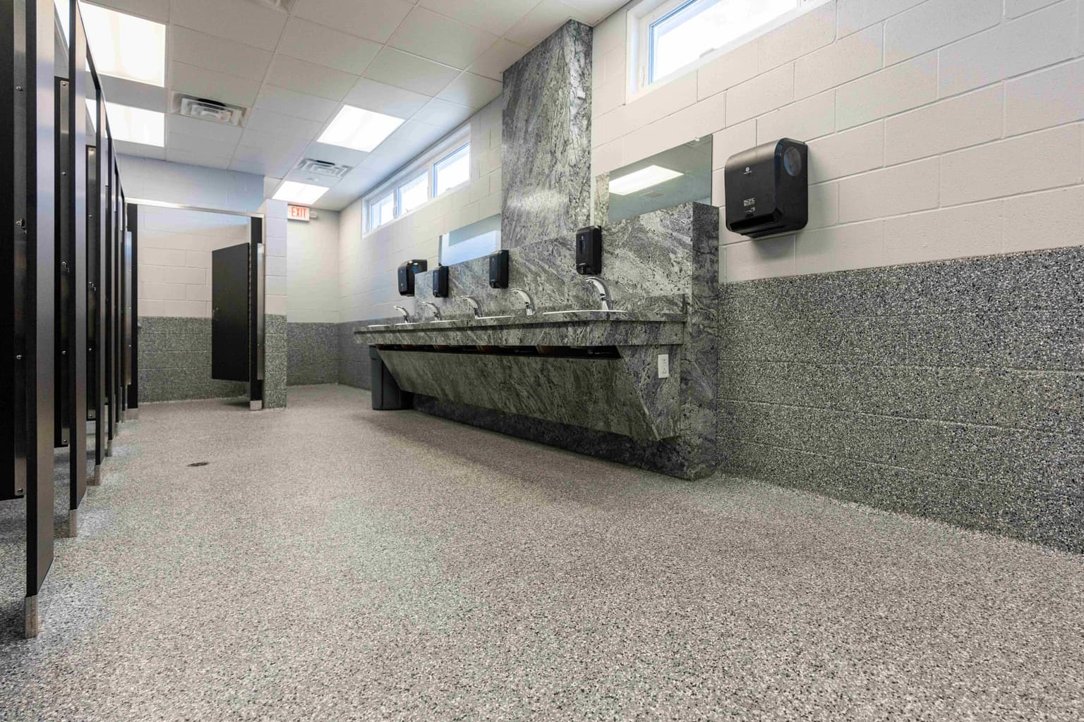 Commercial bathroom with professional floor coating
